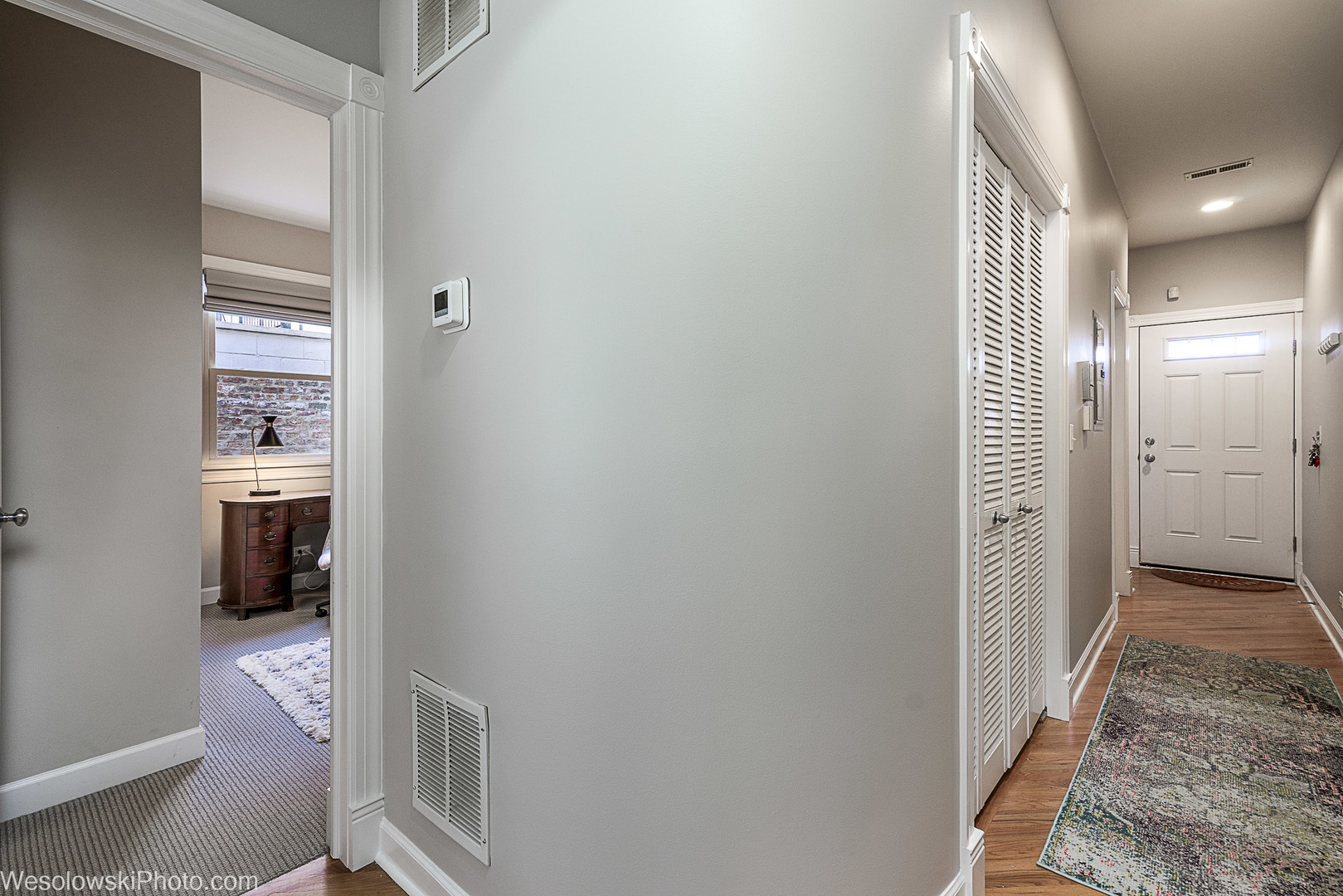 3042 North Oakley Avenue, Unit 2S Chicago, IL 60618 - Photo 7 of 19 a view of a hallway with a livingroom and a bathroom