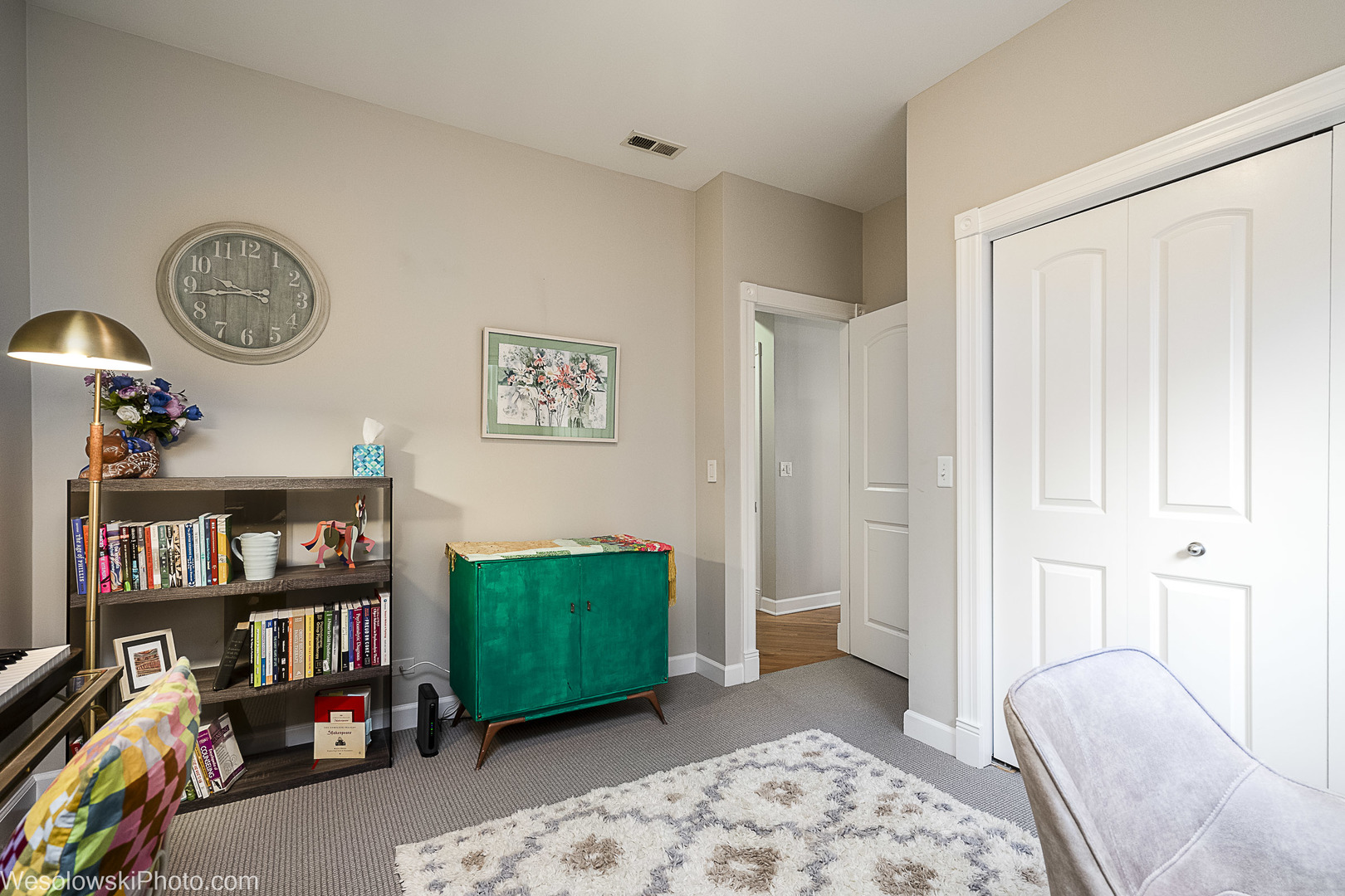 3042 North Oakley Avenue, Unit 2S Chicago, IL 60618 - Photo 9 of 19 a bedroom with furniture and a book shelf