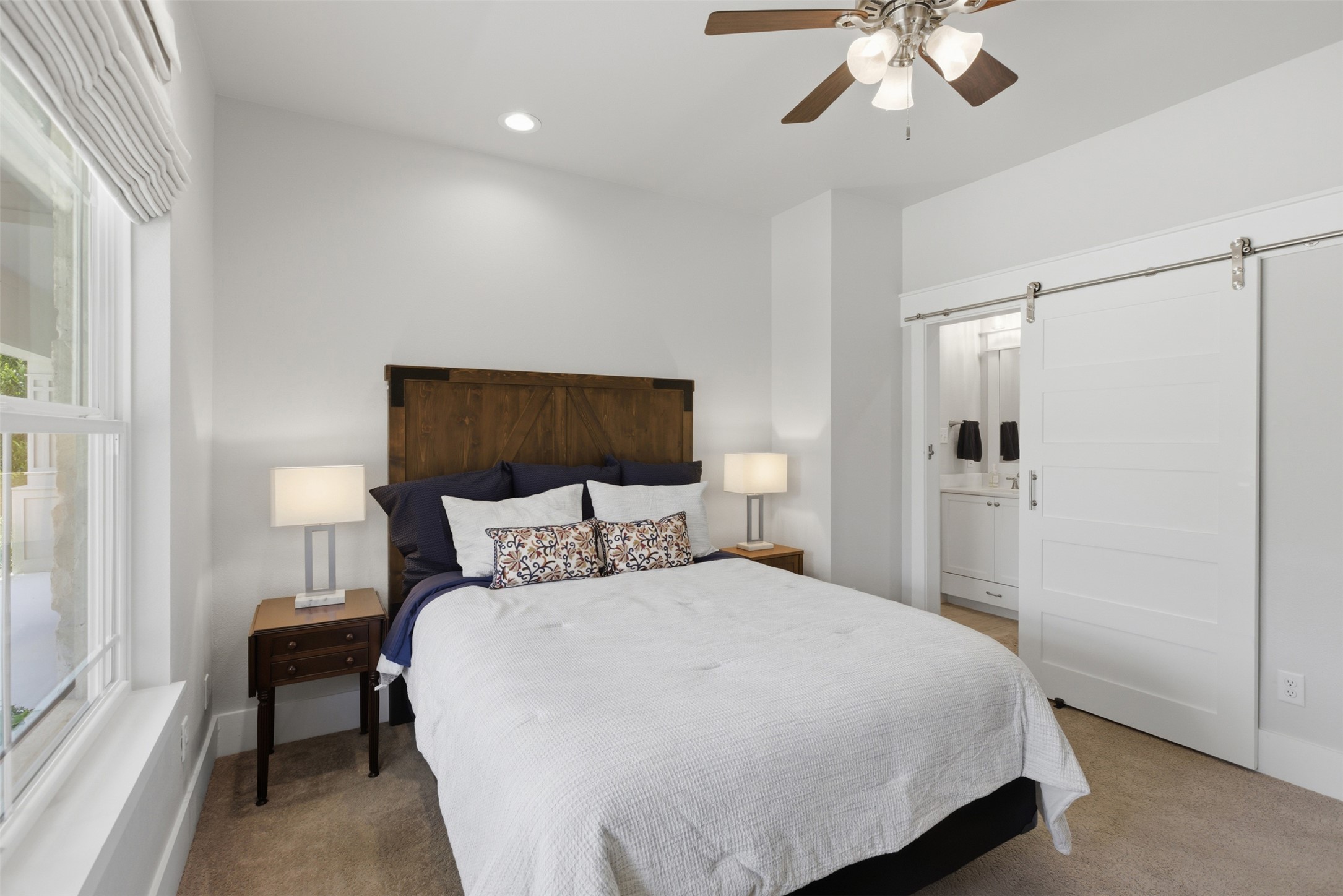 1804 Tanner Loop Taylor, TX 76574 - Photo 23 of 40 This is the perfect guest suite with detailed barn door access to the full bath.