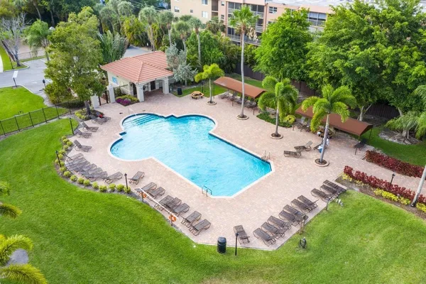 a view of a swimming pool with a yard