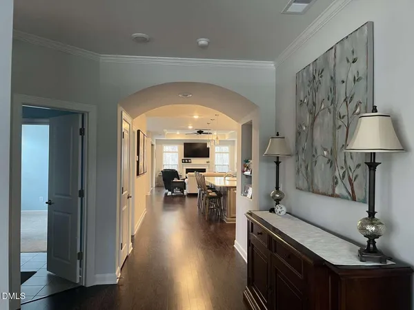 a large kitchen with a table and chairs