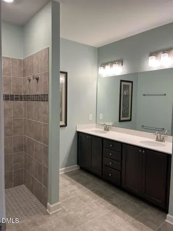 a bathroom with a granite countertop sink