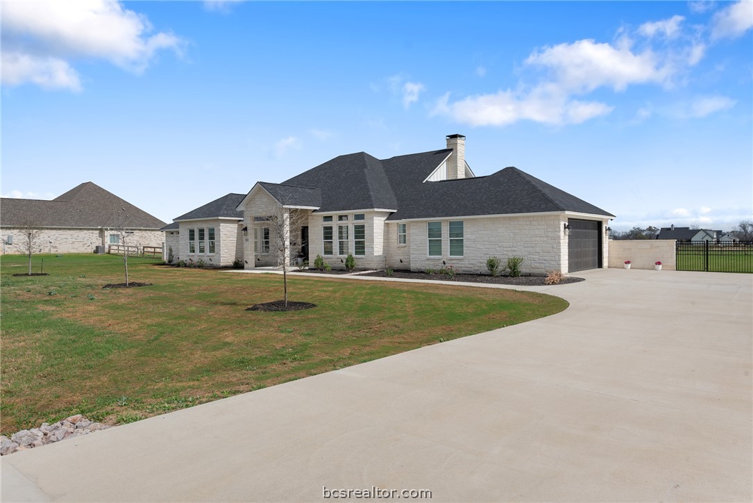 7844 Mathis Crk Drive Bryan, TX 77808 - Photo 3 of 48 a view of a house with a yard