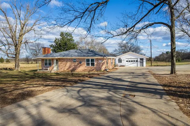 a view of house with yard