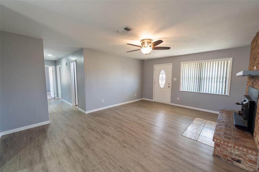 2339 Southwest County Road 3110 Mount Vernon, TX 75457 - Photo 14 of 31 a view of an empty room with a window and wooden floor
