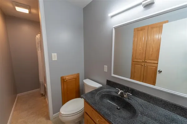 a bathroom with a glass shower door