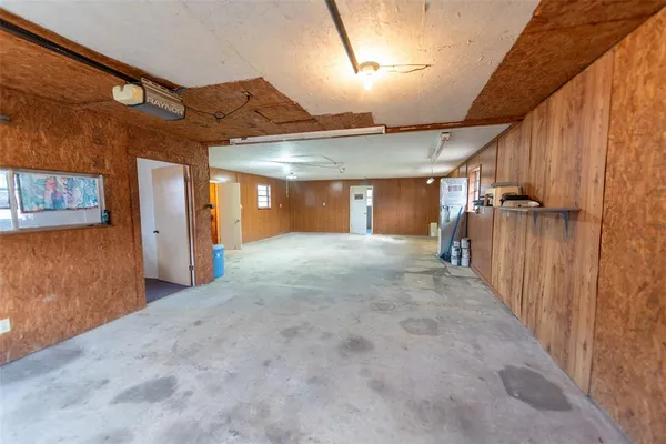 a view of room with window and wooden floor