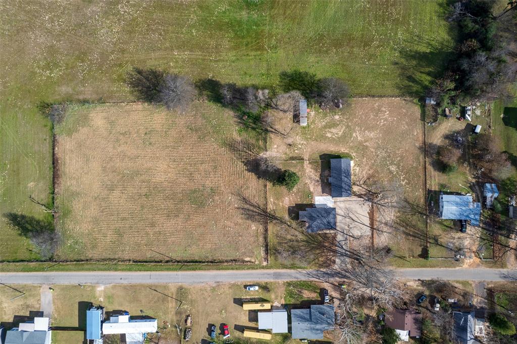 2339 Southwest County Road 3110 Mount Vernon, TX 75457 - Photo 31 of 31 an aerial view of residential houses with outdoor space