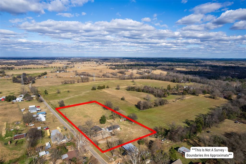 2339 Southwest County Road 3110 Mount Vernon, TX 75457 - Photo 7 of 31 an aerial view of residential houses with outdoor space