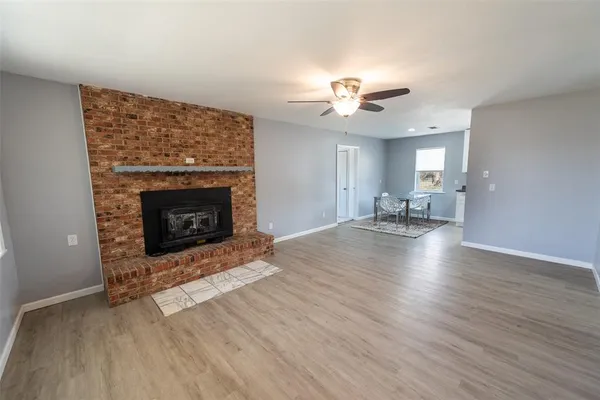 a kitchen with stainless steel appliances kitchen island granite countertop a sink and a stove