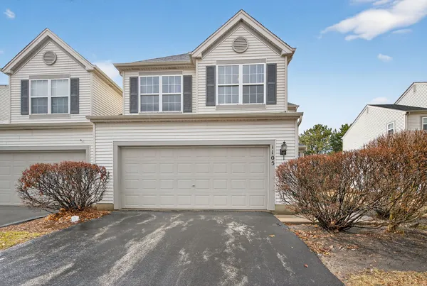 a front view of a house with a garage