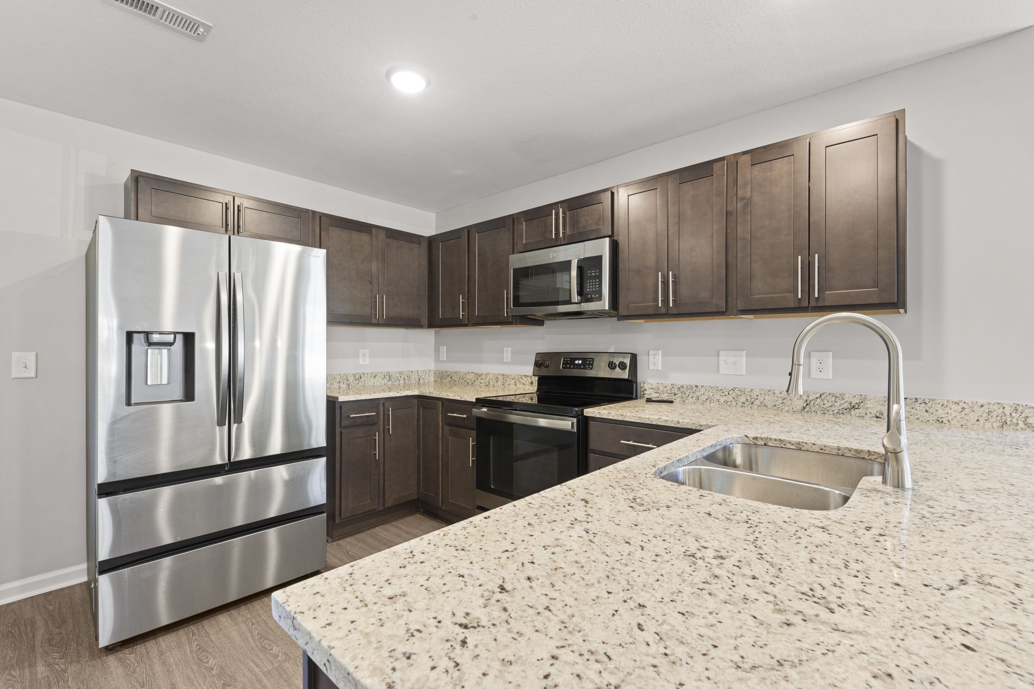 119 Davis Ridge Lane Clarksville, TN 37040 - Photo 14 of 30 a kitchen with a refrigerator sink and wooden cabinets