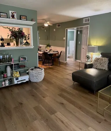 a living room with furniture and a rug