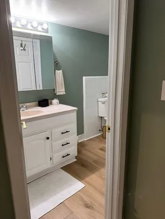a bedroom with a bed and a chair
