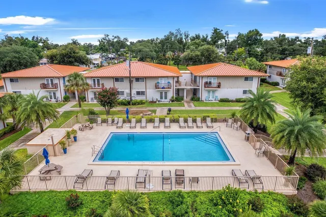 a view of swimming pool with outdoor seating and yard