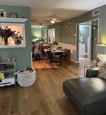 a living room with furniture and a table