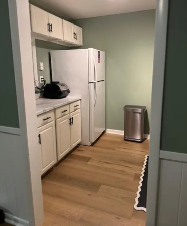a kitchen with stainless steel appliances granite countertop a sink a stove and cabinets