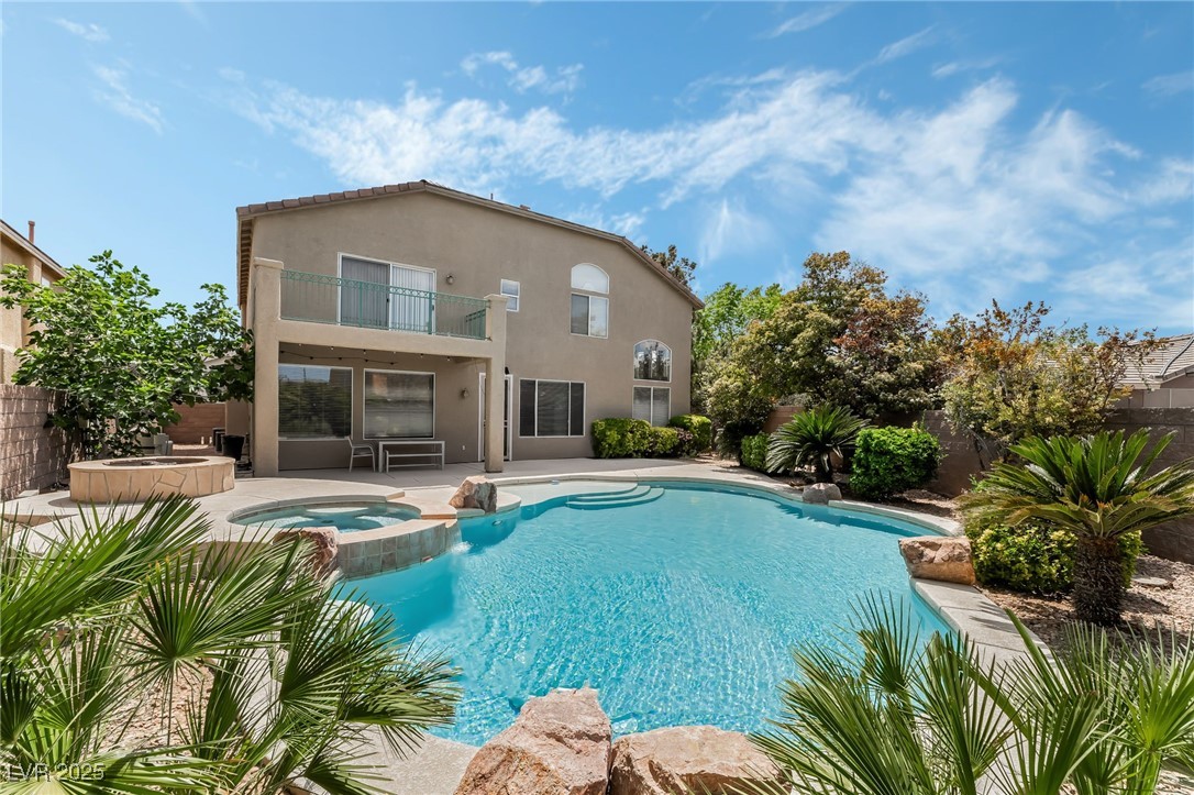 2392 Rainswept Avenue Henderson, NV 89052 - Photo 46 of 49 View of pool with a pool with connected hot tub, a patio, and fence