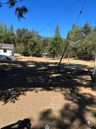 a kitchen with granite countertop a sink stove and cabinets
