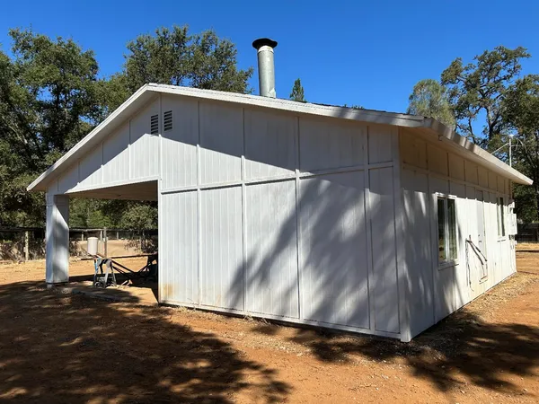 a view of outdoor space yard and blue swimming pool