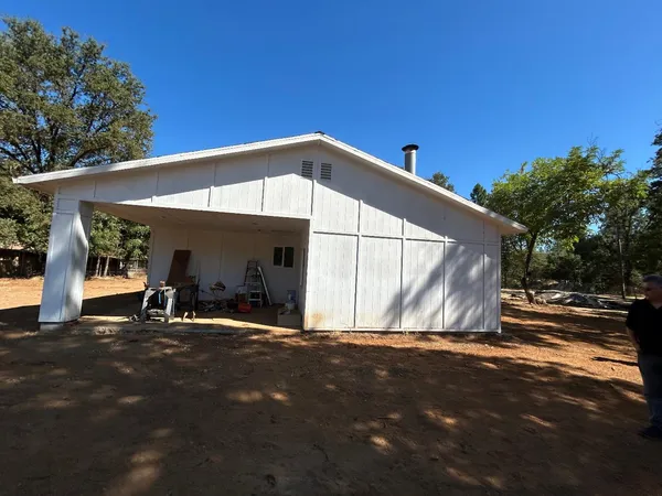 a view of large yard with a tree