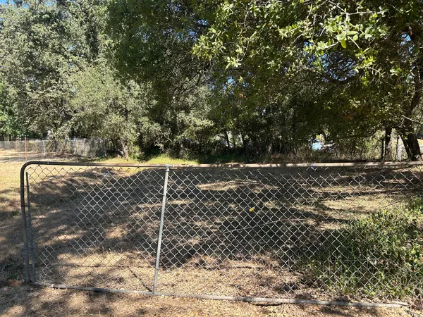 a view of a house with a yard covered in snow