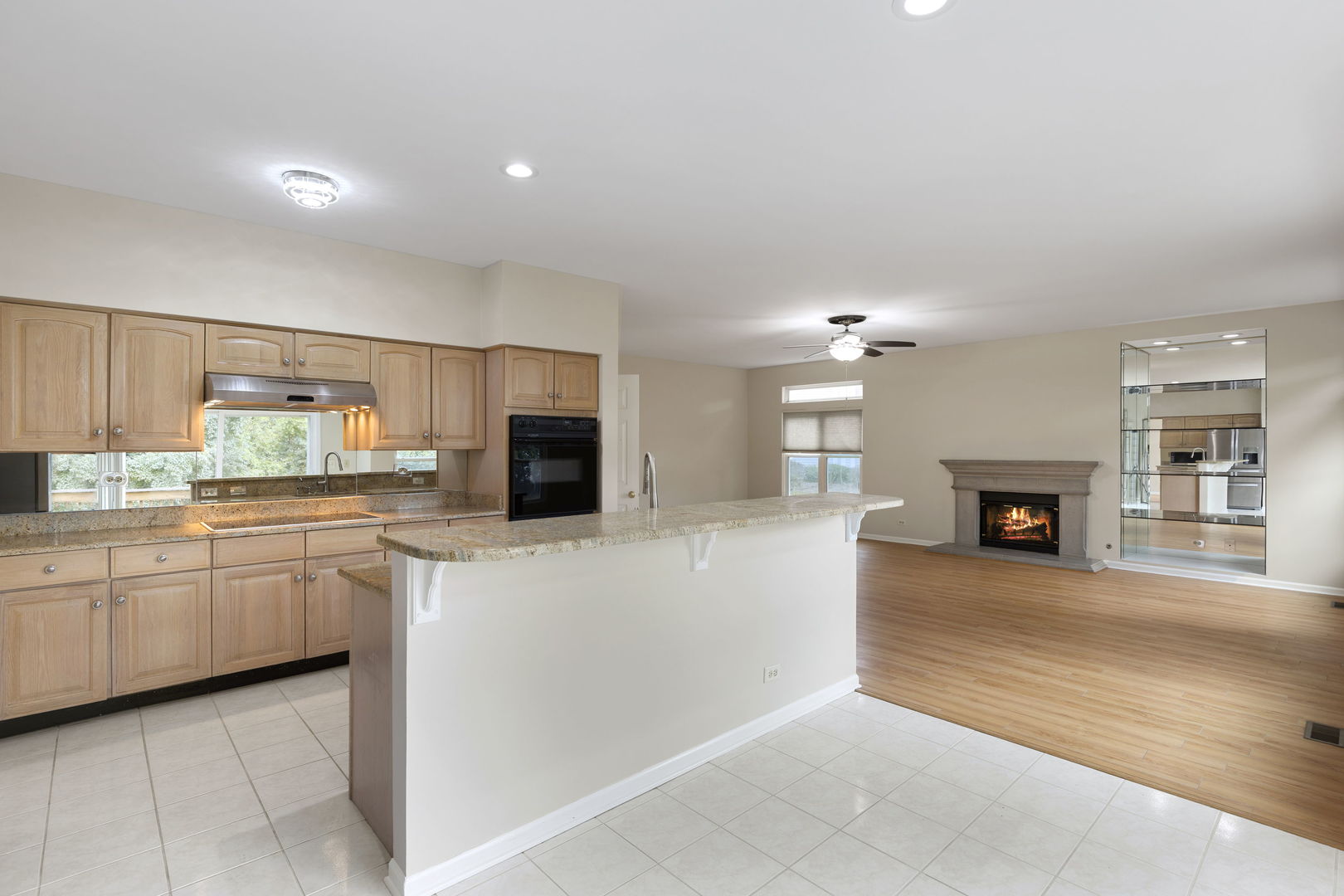 7623 Beringer Court Gurnee, IL 60031 - Photo 12 of 28 a large kitchen with kitchen island a sink stainless steel appliances and cabinets