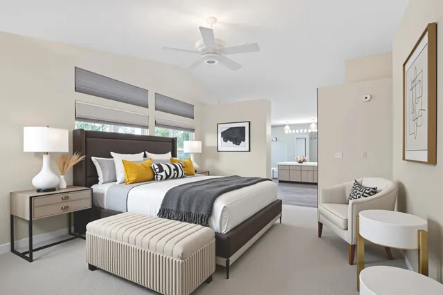 a bedroom with a bed and lamp