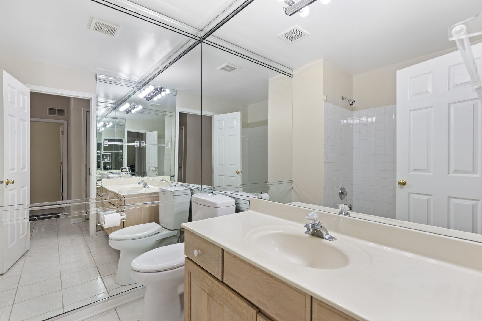 7623 Beringer Court Gurnee, IL 60031 - Photo 6 of 28 a bathroom with a double vanity sink toilet and shower