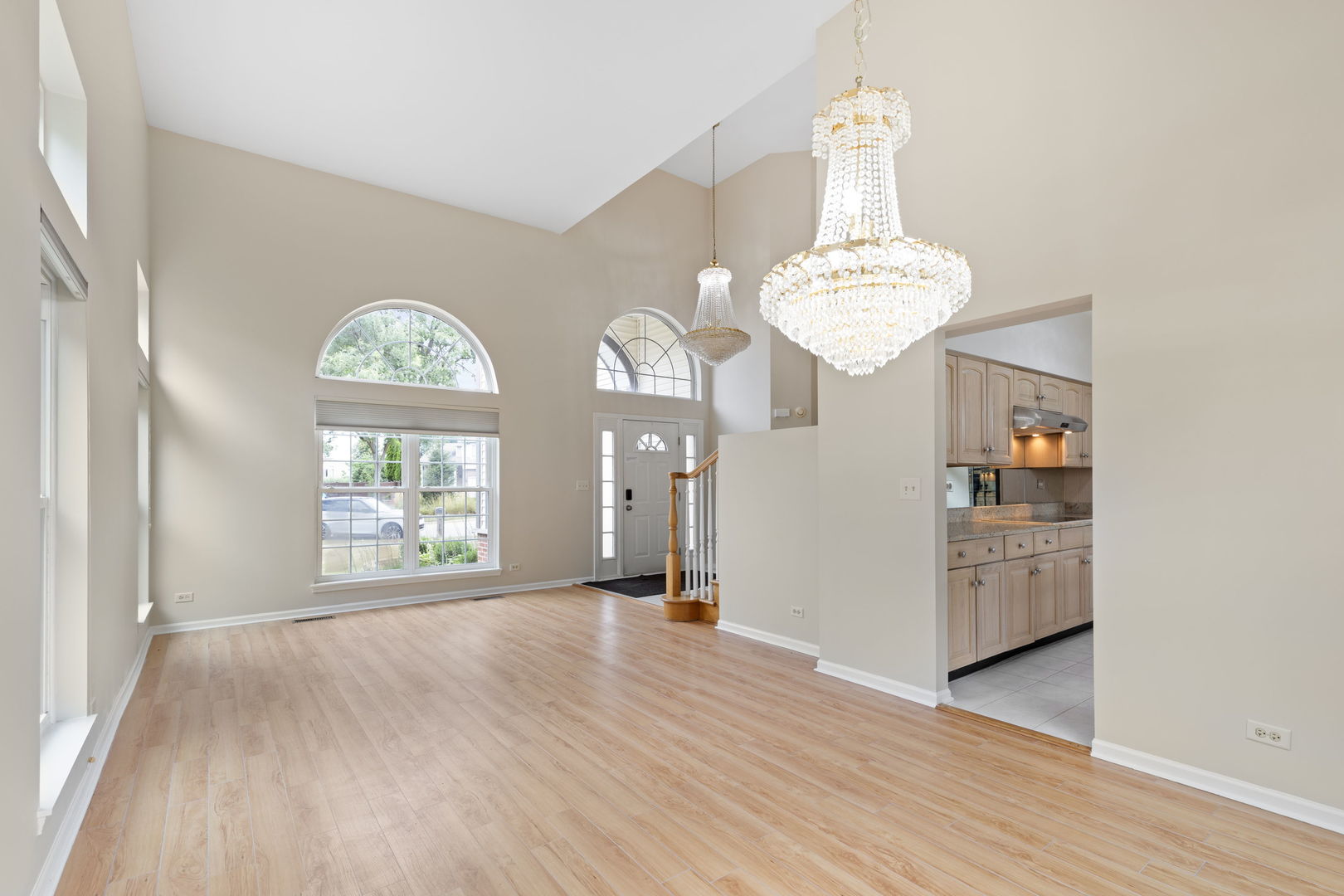 7623 Beringer Court Gurnee, IL 60031 - Photo 8 of 28 wooden floor in an empty room with a window