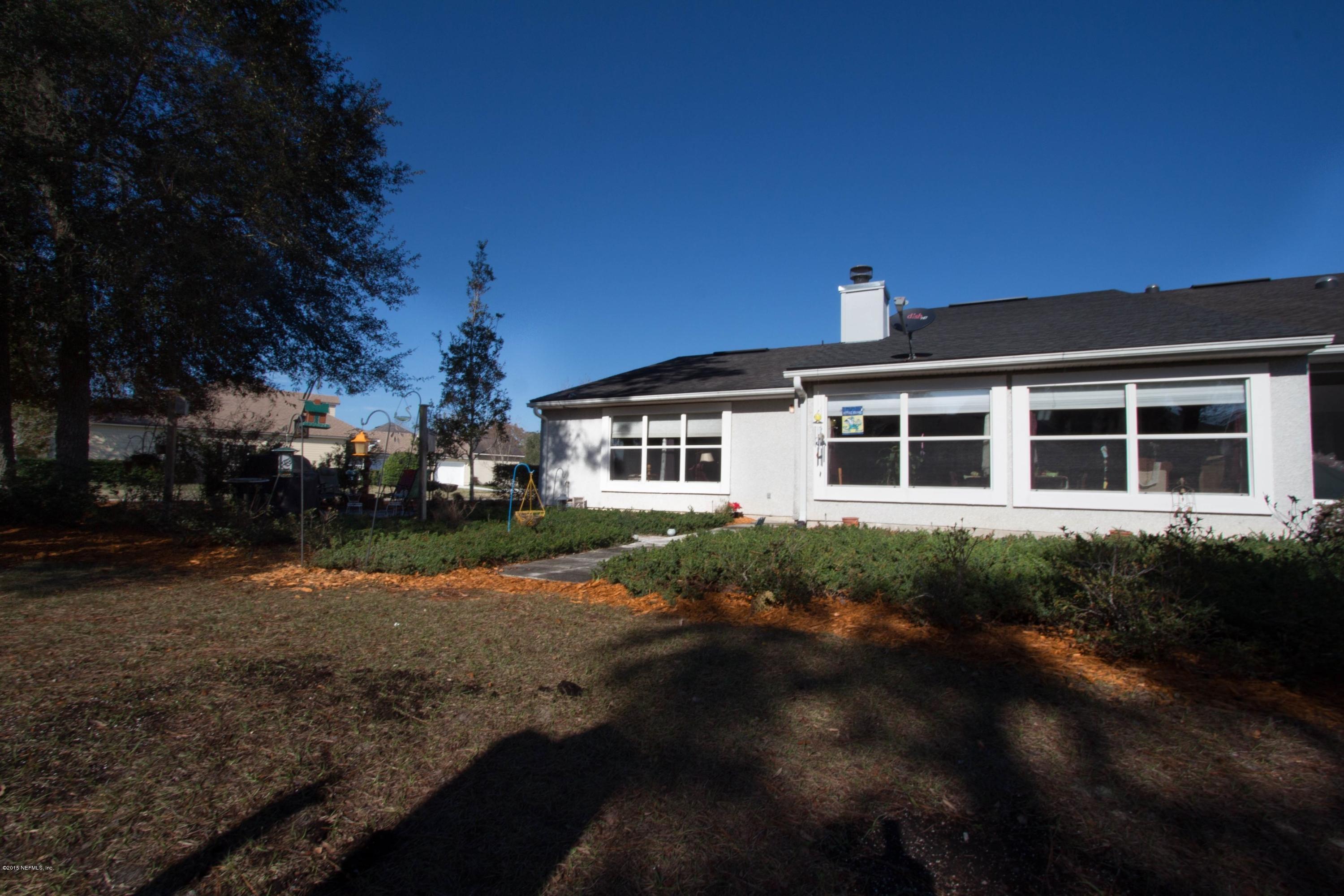 3140 Ravines Road Middleburg, FL 32068 - Photo 27 of 28 a front view of a house with a yard