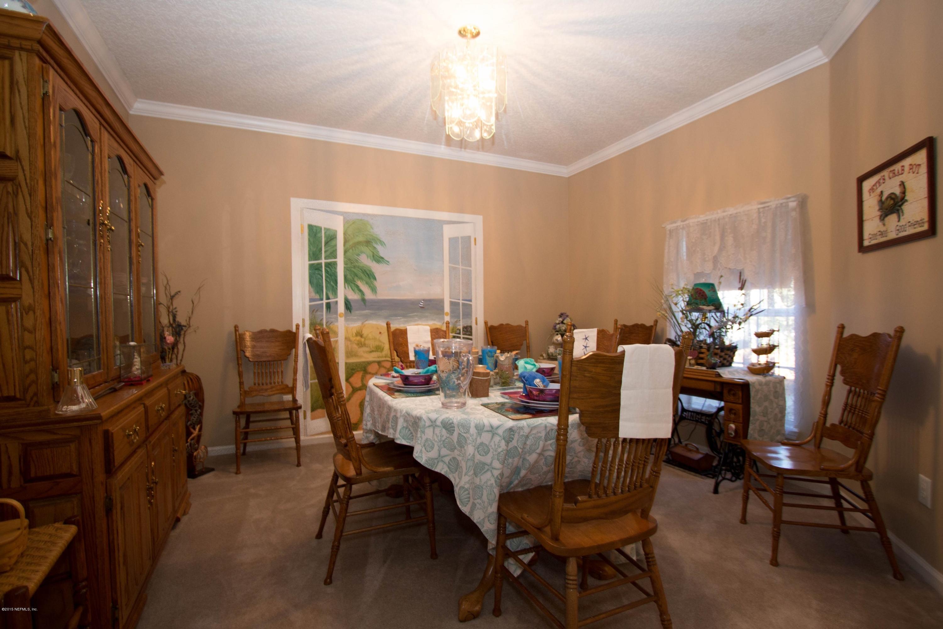 3140 Ravines Road Middleburg, FL 32068 - Photo 7 of 28 a view of a dining room with furniture window and outside view