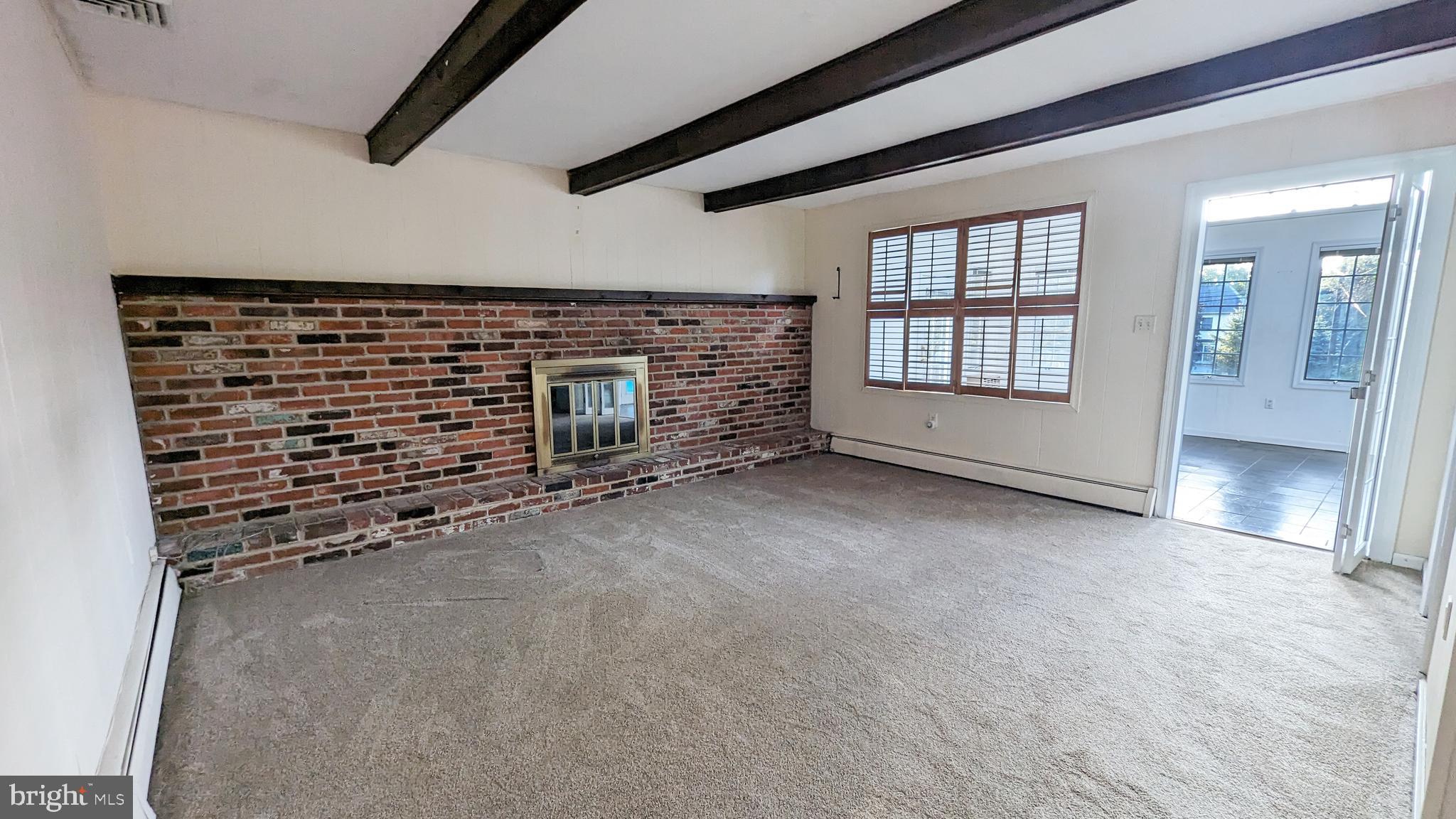 20 Valley View Drive Doylestown, PA 18901 - Photo 10 of 18 Family room w/wood-burning fireplace and half bath