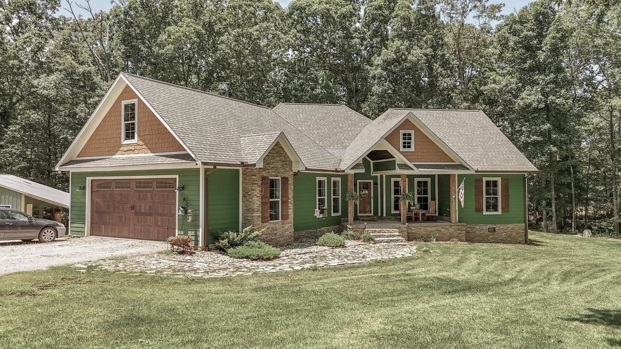 2134 Otis Plunk Road Bethel Springs, TN 38315 - Photo 32 of 35 a front view of a house with a yard