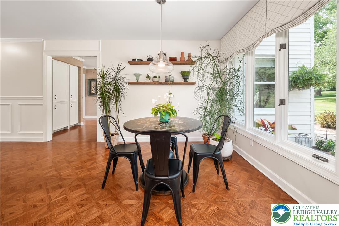 1588 Surrey Road Bethlehem, PA 18015 - Photo 17 of 50 a view of a dining room with furniture and a potted plant