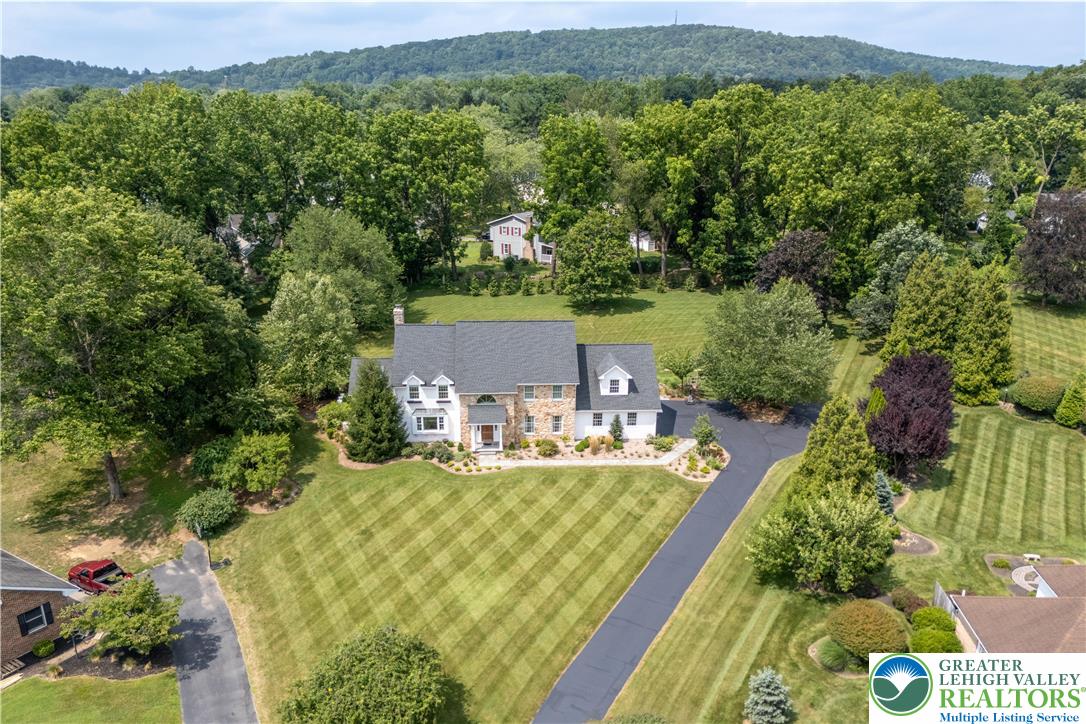 1588 Surrey Road Bethlehem, PA 18015 - Photo 2 of 50 an aerial view of a house with yard swimming pool and mountain view