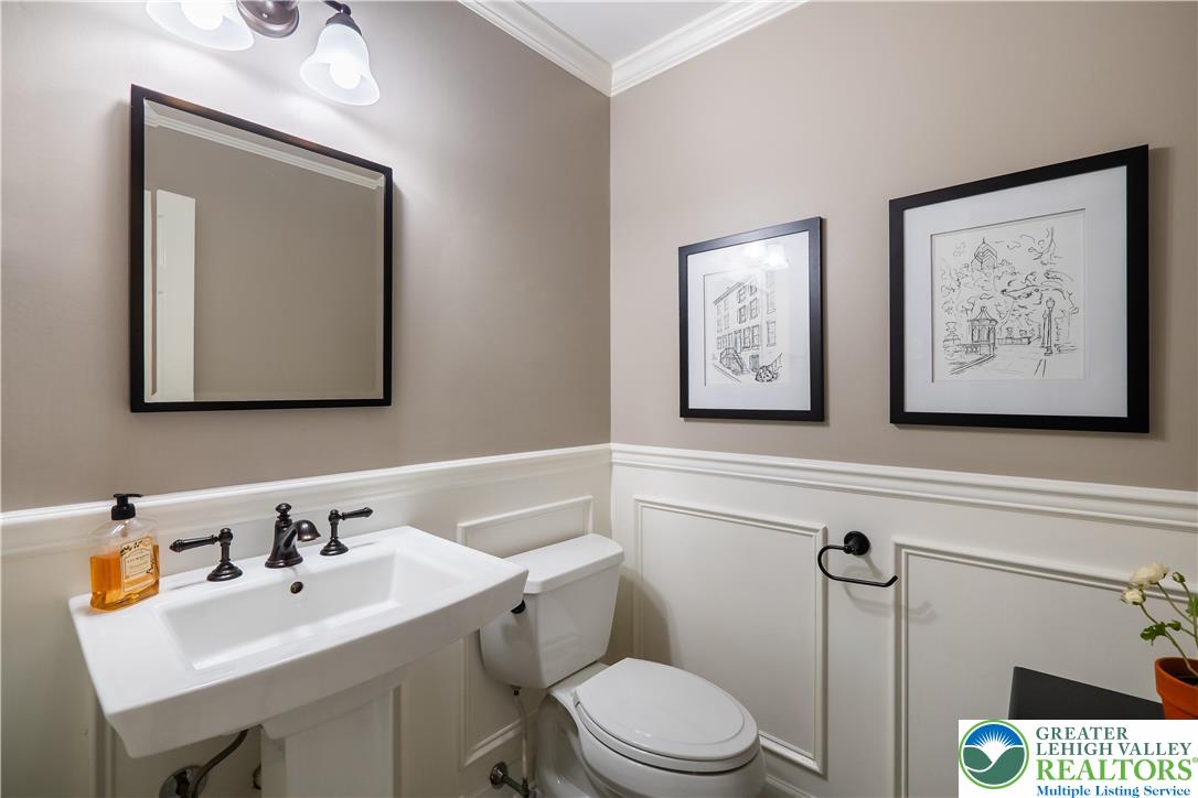1588 Surrey Road Bethlehem, PA 18015 - Photo 23 of 50 a bathroom with a toilet sink and mirror