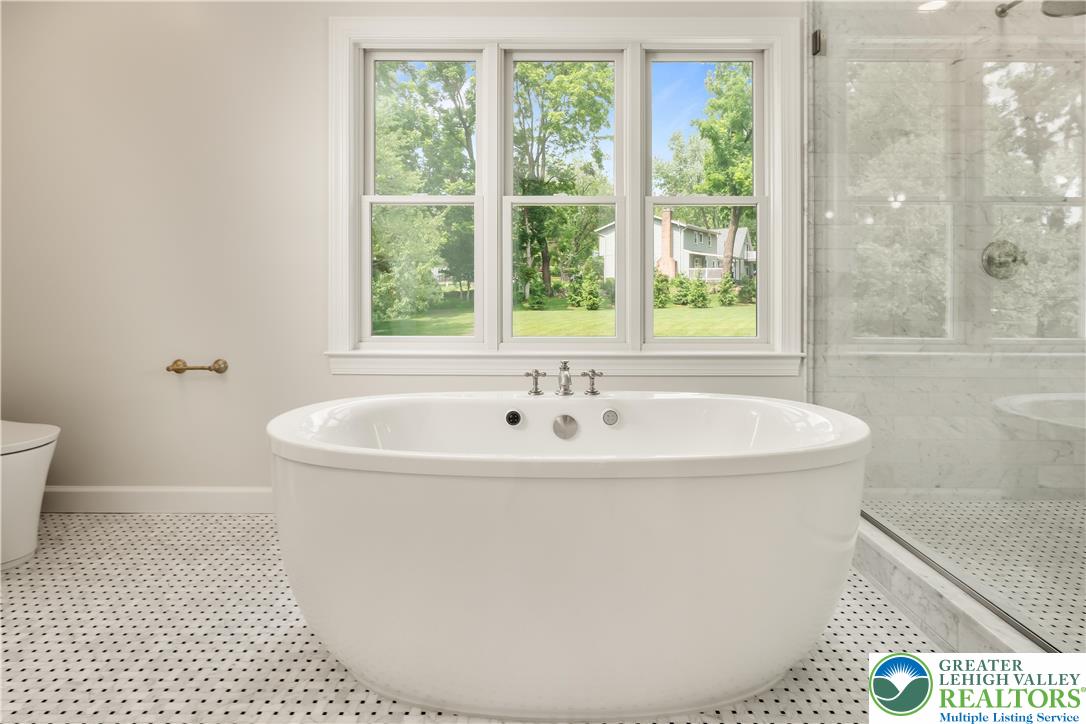 1588 Surrey Road Bethlehem, PA 18015 - Photo 28 of 50 a white bath tub sitting in a bathroom next to a window