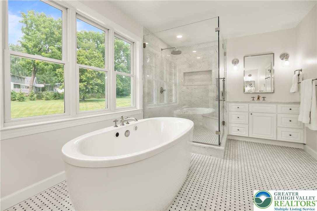 1588 Surrey Road Bethlehem, PA 18015 - Photo 29 of 50 a bathroom with a sink a toilet a mirror and a shower