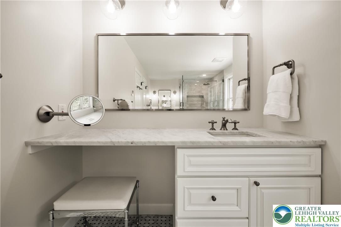 1588 Surrey Road Bethlehem, PA 18015 - Photo 31 of 50 a bathroom with a sink and a mirror
