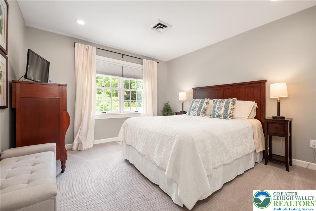 1588 Surrey Road Bethlehem, PA 18015 - Photo 33 of 50 a large bed sitting in a bedroom next to a window