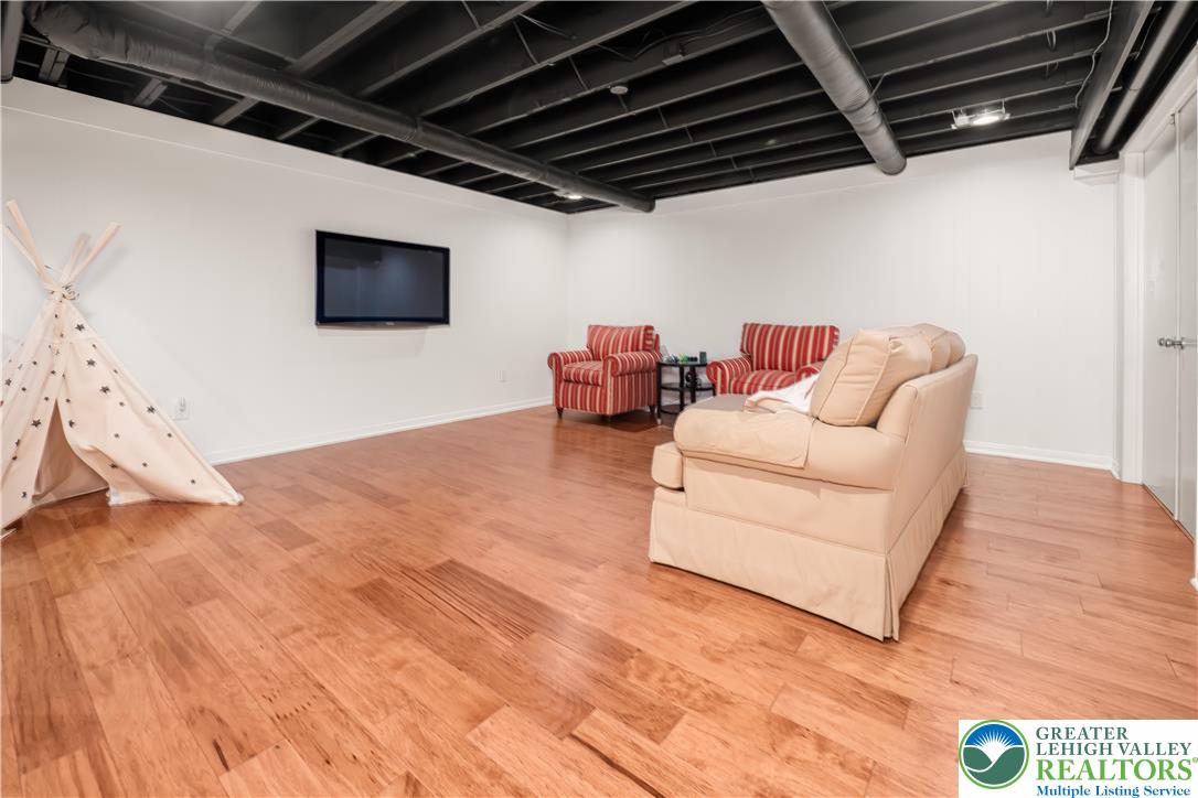 1588 Surrey Road Bethlehem, PA 18015 - Photo 42 of 50 a living room with furniture and a flat screen tv