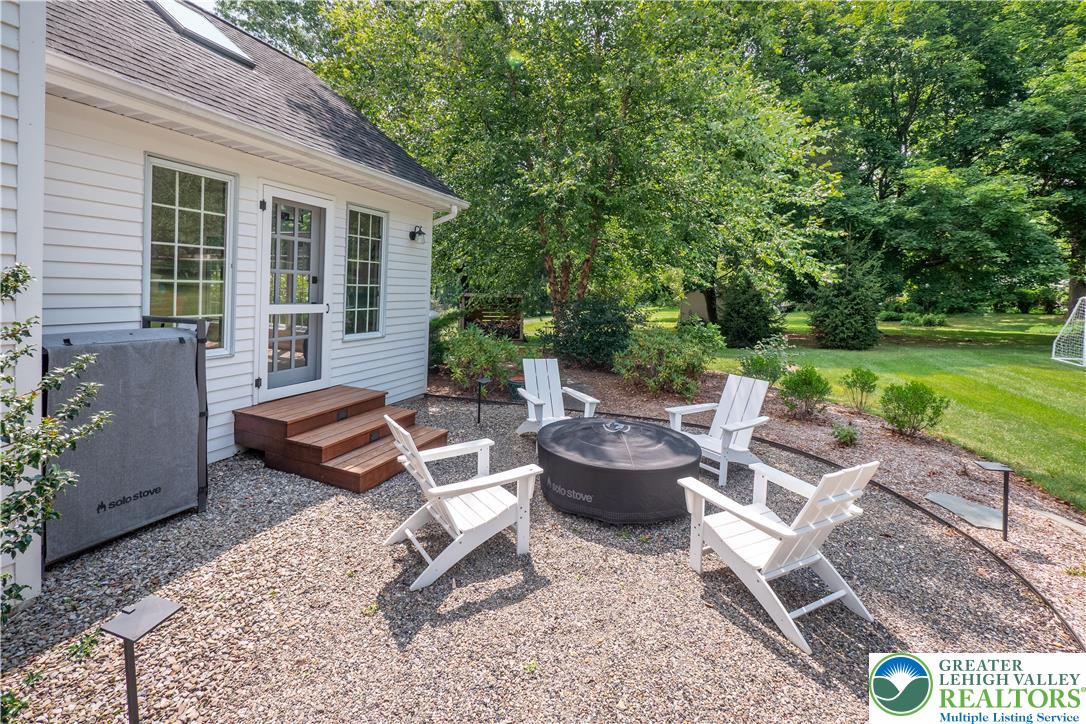 1588 Surrey Road Bethlehem, PA 18015 - Photo 46 of 50 a view of a patio with couches and a table and chairs with garden