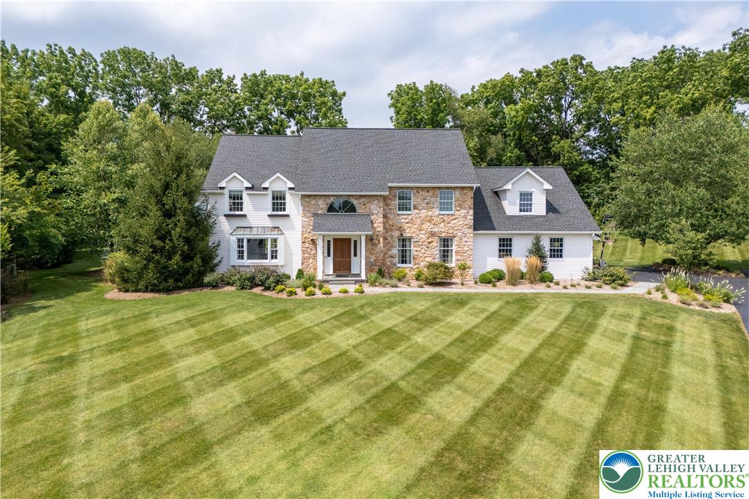 1588 Surrey Road Bethlehem, PA 18015 - Photo 50 of 50 a view of a house with a yard and potted plants