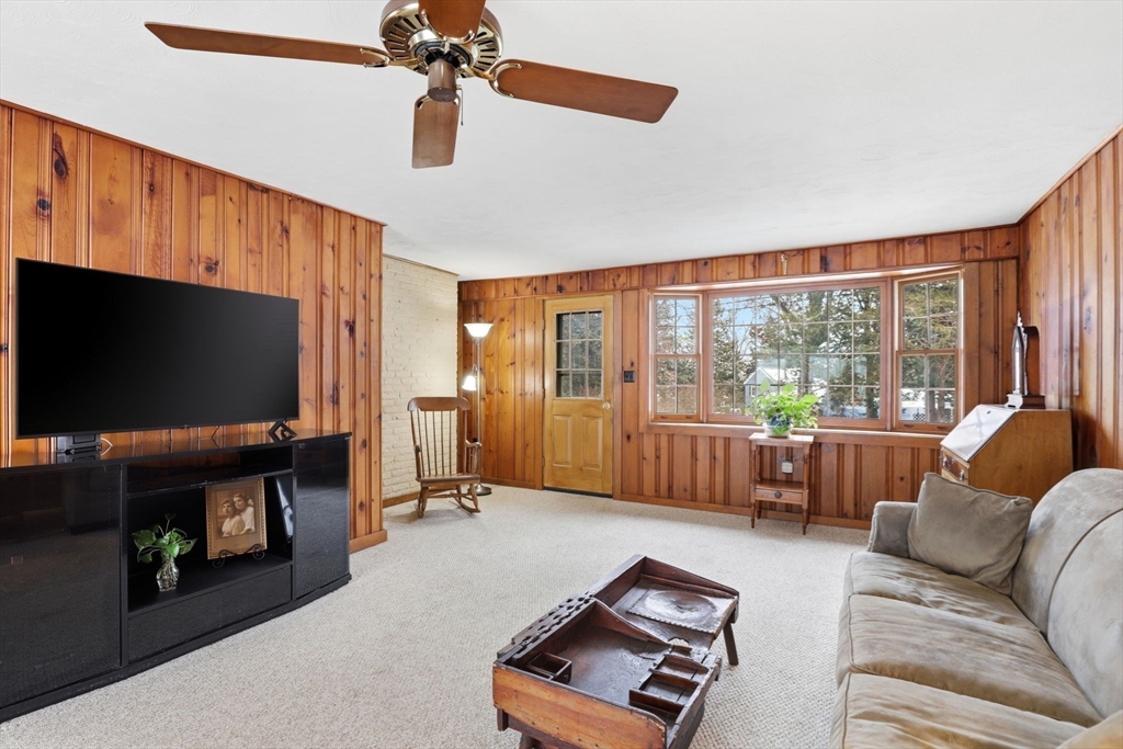 49 Jackson Road Scituate, MA 02066 - Photo 7 of 25 a living room with furniture and a flat screen tv
