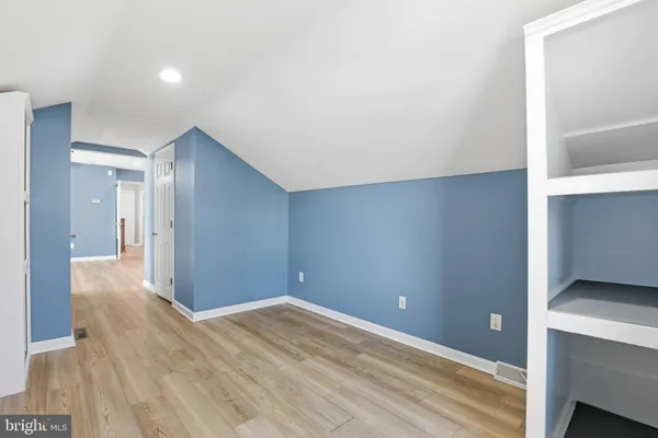 a view of a room with wooden walls