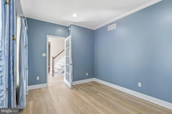 a view of entryway with wooden floor