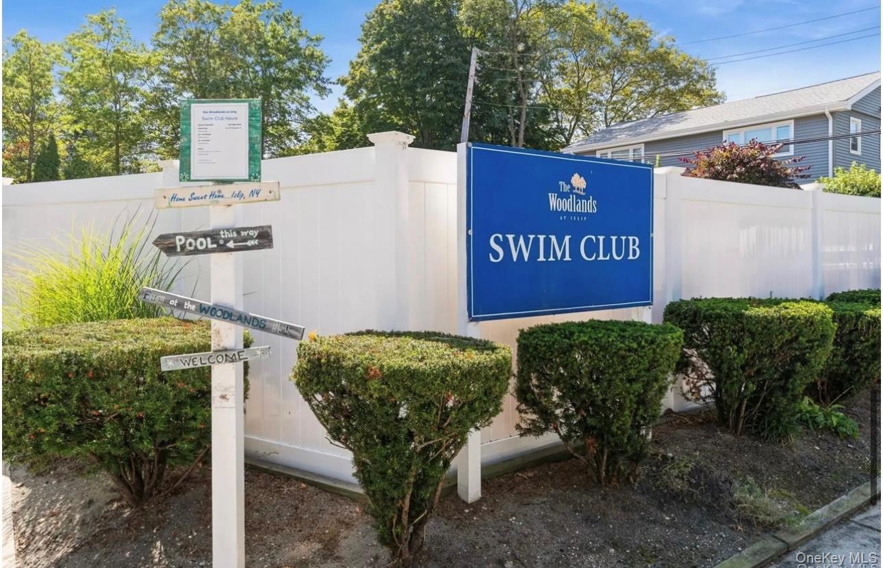 83 Finch Lane, Unit 2B Islip, NY 11751 - Photo 17 of 18 a view of outdoor space with sign board