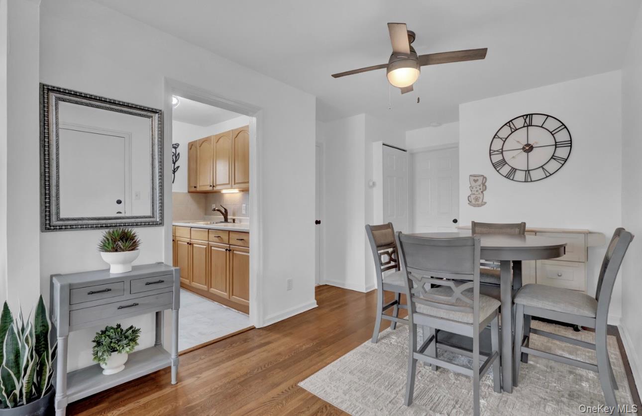 83 Finch Lane, Unit 2B Islip, NY 11751 - Photo 3 of 18 a living room with furniture and a table