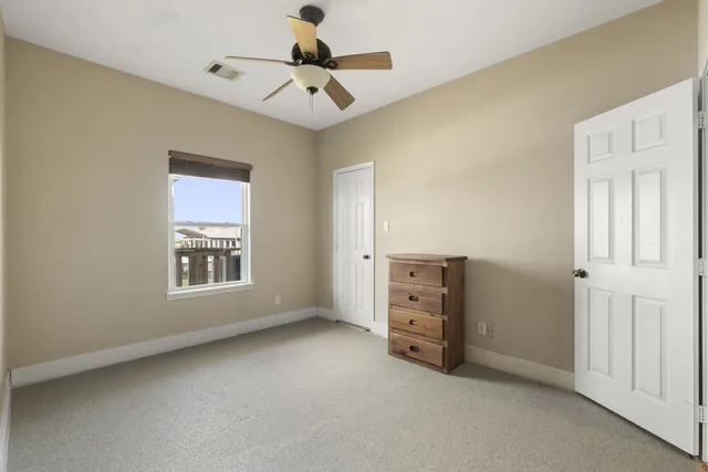 a bedroom with a bed with wooden floor